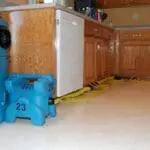 water damage spread through home requiring cabinet drying services